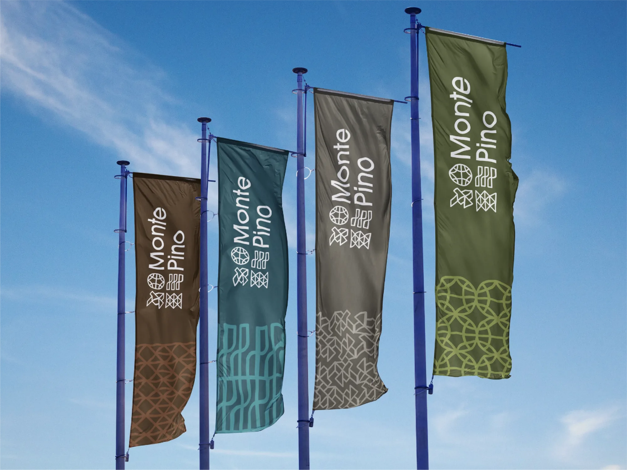 Monte Pino flags in four colors of the palette flying against a blue sky